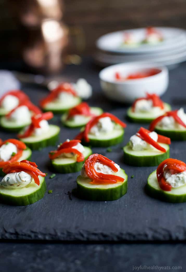 Fresh Simple Cucumber Bites topped with a zesty Herb Cream Cheese and sweet Piquillo Peppers. The perfect refreshing appetizer recipe for your next party! | joyfulhealthyeats.com #glutenfree #vegetarian