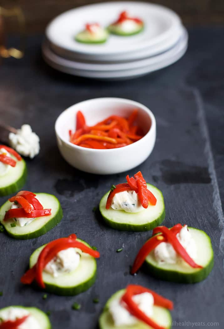 Fresh Simple Cucumber Bites topped with a zesty Herb Cream Cheese and sweet Piquillo Peppers. The perfect refreshing appetizer recipe for your next party! | joyfulhealthyeats.com #glutenfree #vegetarian