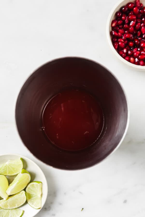 Adding the ingredients to the cocktail shaker. 