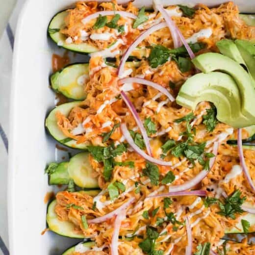 buffalo chicken enchilada boats in a casserole dish