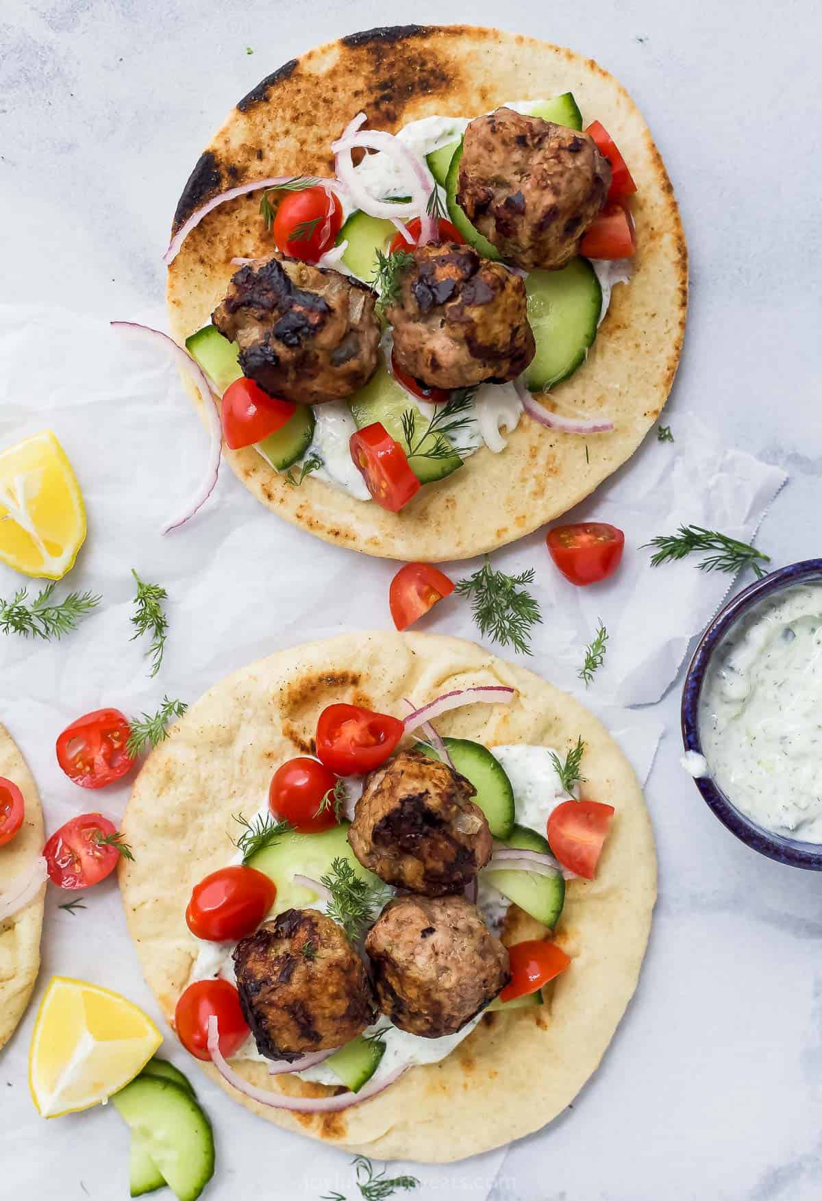 Overhead view of two turkey meatball gyros with tzatziki