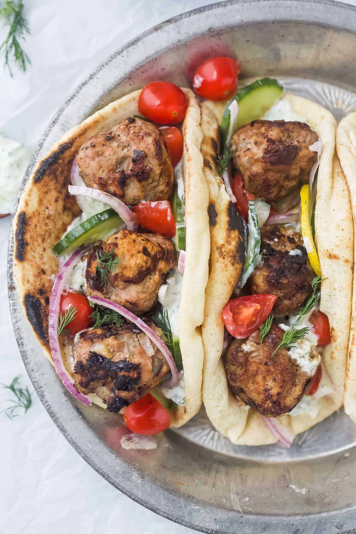 Overhead view of 2 turkey meatball gyros folded