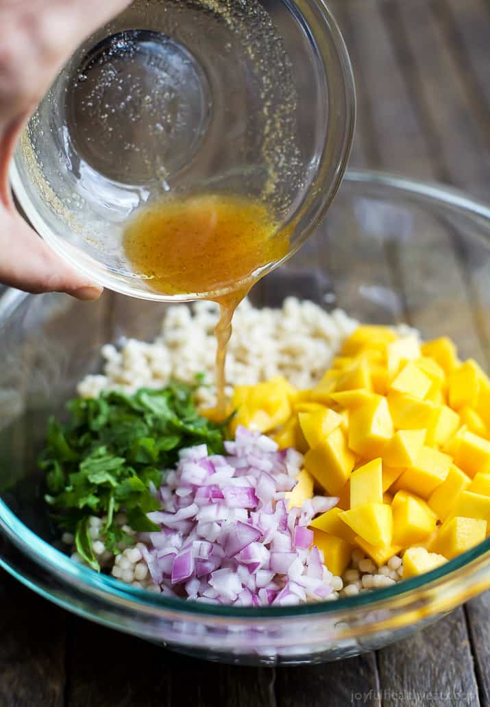 An Easy Mango Couscous Salad packed with sweet mango and a light dressing. This salad is a quick 15 minute side dish you're family will love, perfect with seafood or chicken. | joyfulhealthyeats.com