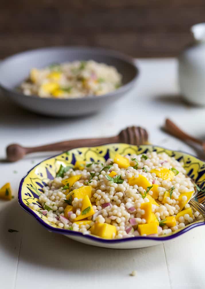 An Easy Mango Couscous Salad packed with sweet mango and a light dressing. This salad is a quick 15 minute side dish you're family will love, perfect with seafood or chicken. | joyfulhealthyeats.com