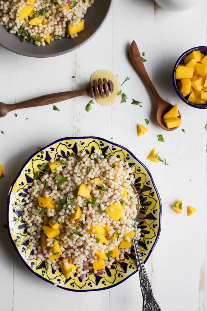 An Easy Mango Couscous Salad packed with sweet mango and a light dressing. This salad is a quick 15 minute side dish you're family will love, perfect with seafood or chicken. | joyfulhealthyeats.com