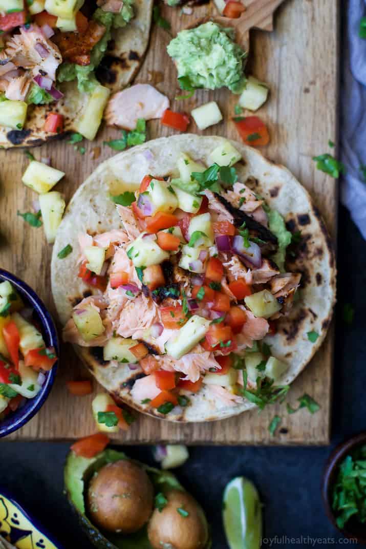 PINEAPPLE CHIPOTLE SALMON TOSTADAS - slightly charred smoky Salmon combined with Spicy Pineapple Salsa and creamy Avocados. These Tostadas take 30 minutes to make and are only 283 calories, a must make for a busy weeknight! | joyfulhealthyeats.com | gluten free recipes