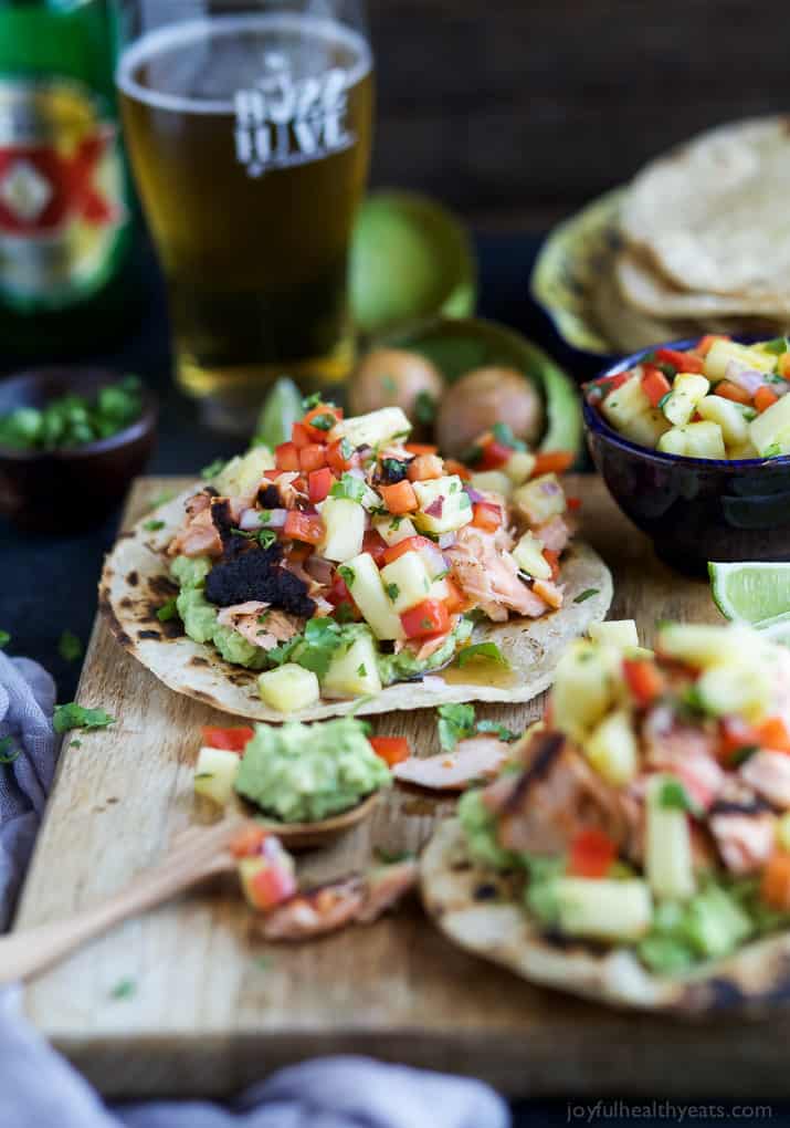 PINEAPPLE CHIPOTLE SALMON TOSTADAS - slightly charred smoky Salmon combined with Spicy Pineapple Salsa and creamy Avocados. These Tostadas take 30 minutes to make and are only 283 calories, a must make for a busy weeknight! | joyfulhealthyeats.com | gluten free recipes