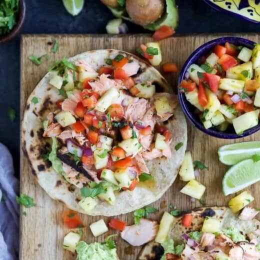 PINEAPPLE CHIPOTLE SALMON TOSTADAS - slightly charred smoky Salmon combined with Spicy Pineapple Salsa and creamy Avocados. These Tostadas take 30 minutes to make and are only 283 calories, a must make for a busy weeknight! | joyfulhealthyeats.com | gluten free recipes