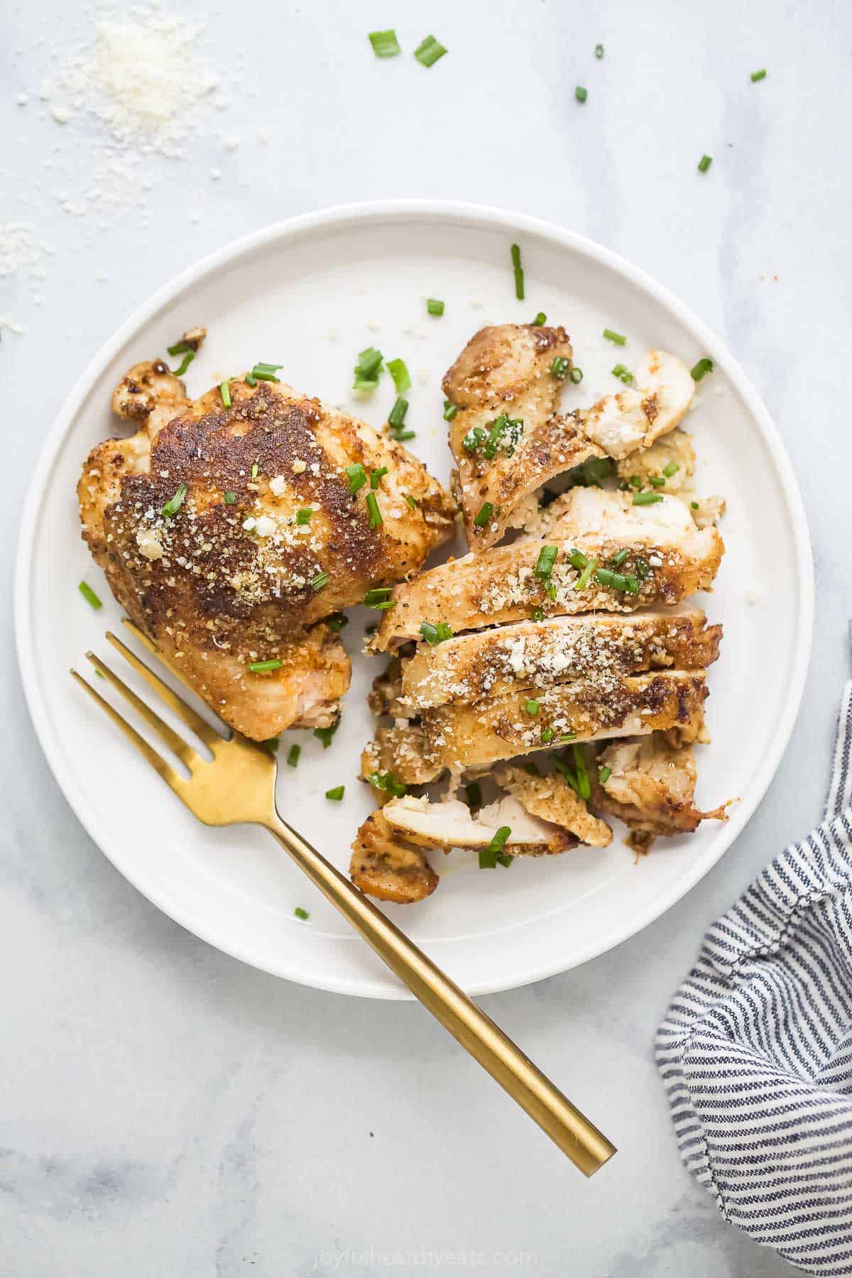 Sliced chicken thighs on a plate. 
