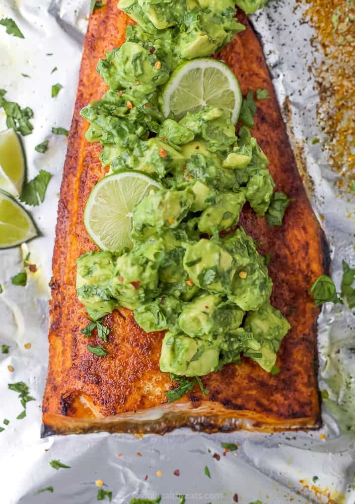 Baked salmon topped with avocado.