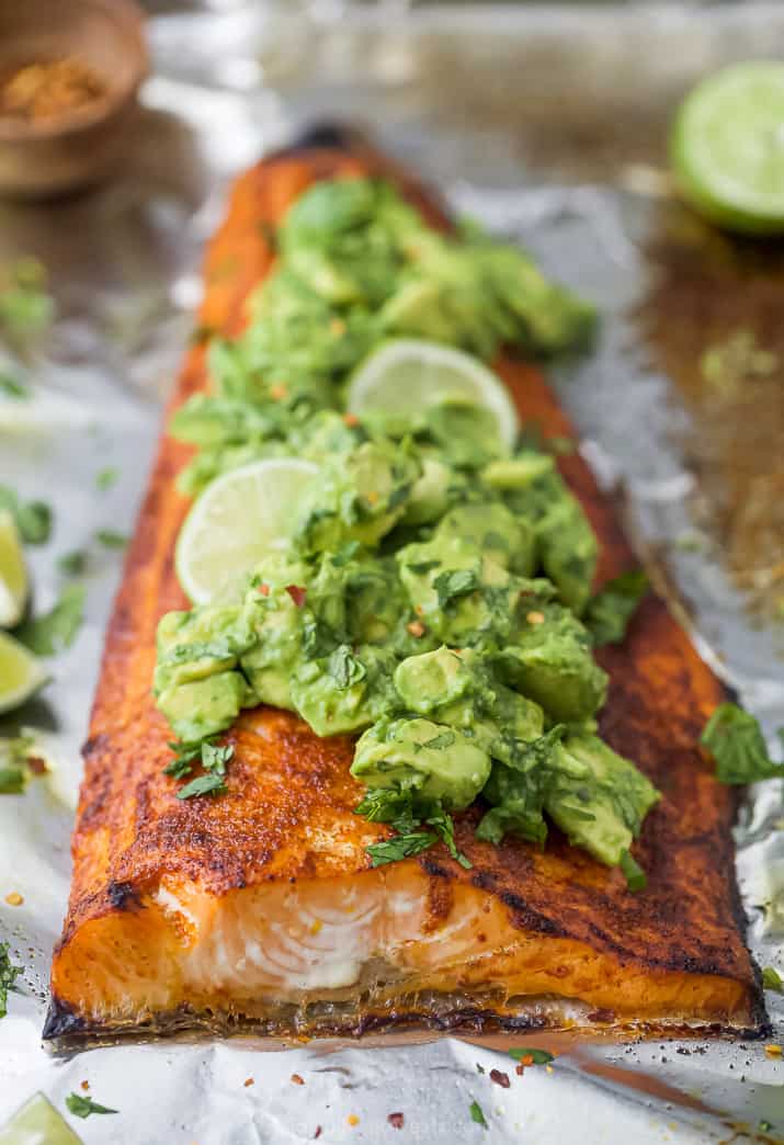 Salmon with spice rub on it that's topped with avocado salsa.