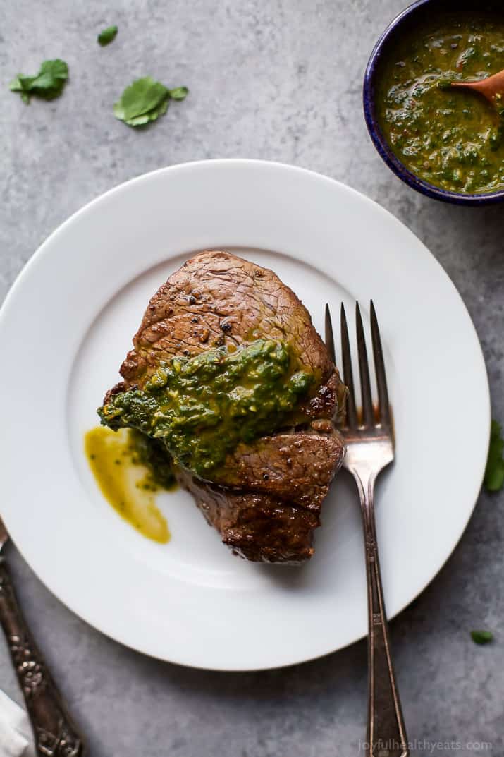 Top view of Filet Mignon with Chimichurri sauce on a plate