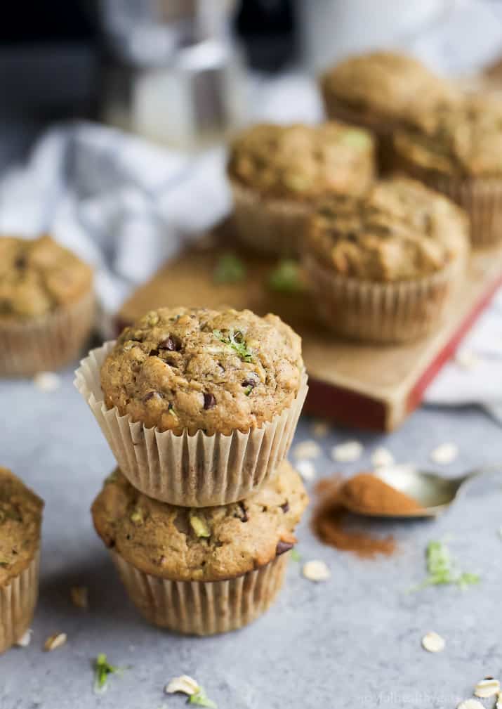 Chocolate Chip Zucchini Muffins stacked on a countertop