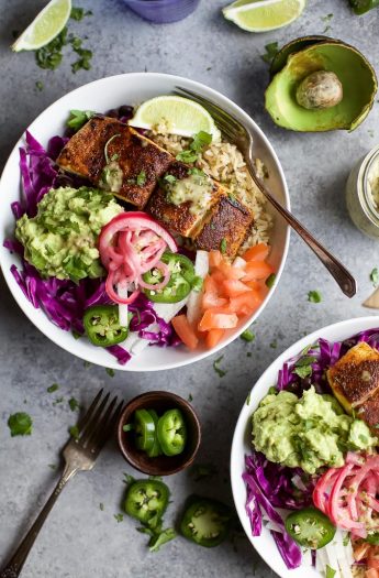 FISH TACO RICE BOWLS with avocado and pickled onions, topped with a Cilantro Lime Dressing! The perfect 30 minute meal to satisfy even the pickiest of eaters! | joyfulhealthyeats.com | Gluten Free Recipes