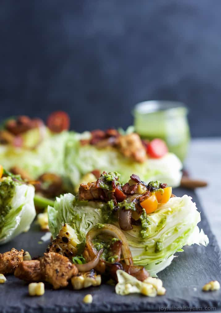 SOUTHWESTERN WEDGE SALAD with seasoned chicken, bacon, onion rings, charred corn a POBLANO DRESSING you'll adore. The wedge salad only takes 30 minutes to make & is under 400 calories a serving! | joyfulhealthyeats.com | Gluten Free Recipes