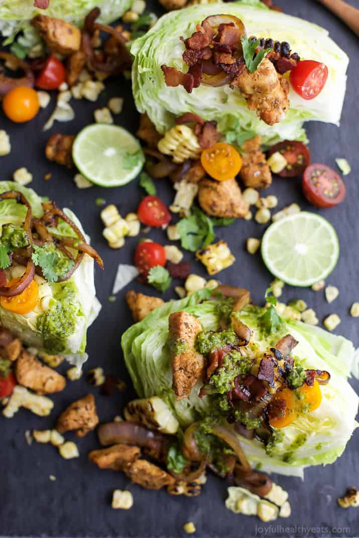 SOUTHWESTERN WEDGE SALAD with seasoned chicken, bacon, onion rings, charred corn a POBLANO DRESSING you'll adore. The wedge salad only takes 30 minutes to make & is under 400 calories a serving! | joyfulhealthyeats.com | Gluten Free Recipes