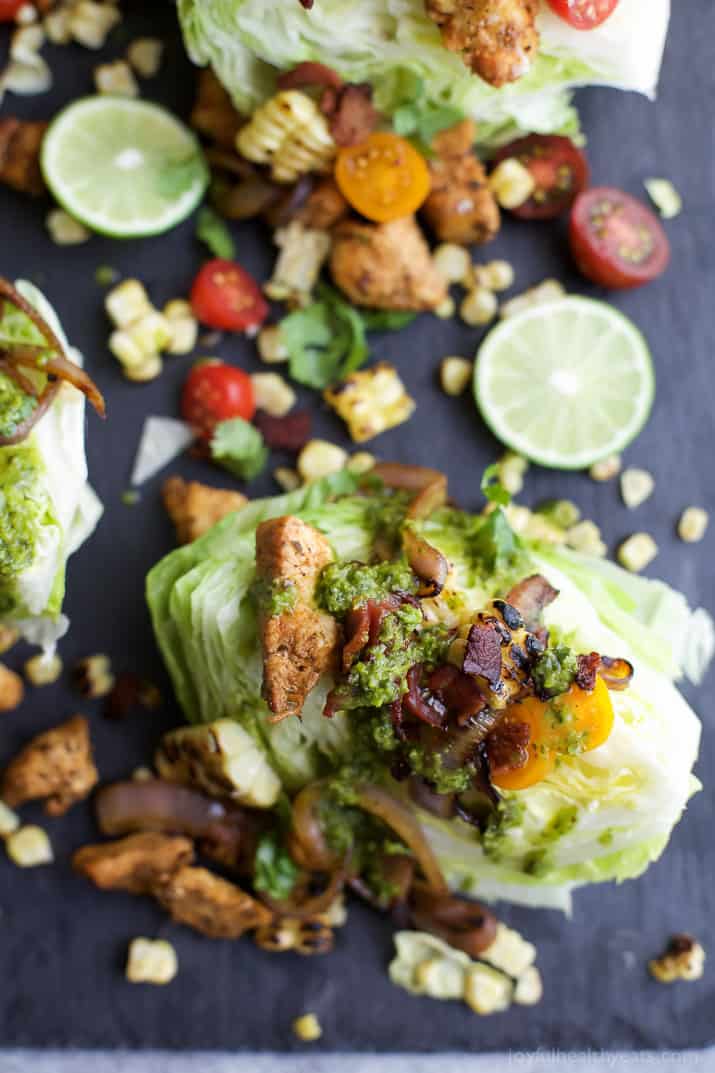 SOUTHWESTERN WEDGE SALAD with seasoned chicken, bacon, onion rings, charred corn a POBLANO DRESSING you'll adore. The wedge salad only takes 30 minutes to make & is under 400 calories a serving! | joyfulhealthyeats.com | Gluten Free Recipes