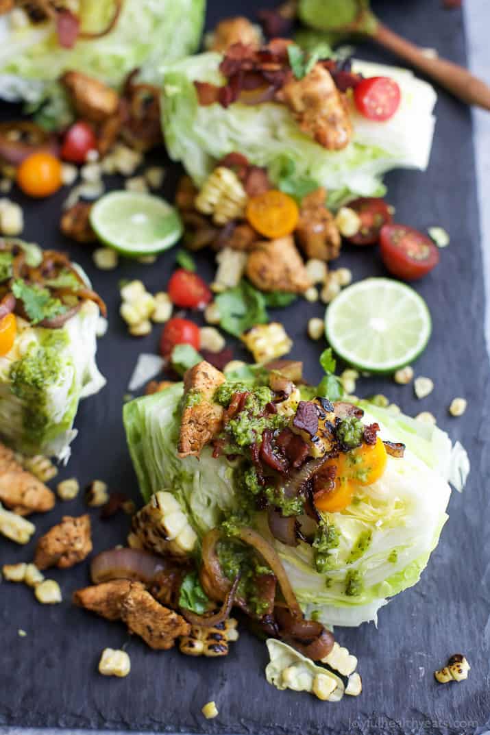 SOUTHWESTERN WEDGE SALAD with seasoned chicken, bacon, onion rings, charred corn a POBLANO DRESSING you'll adore. The wedge salad only takes 30 minutes to make & is under 400 calories a serving! | joyfulhealthyeats.com | Gluten Free Recipes