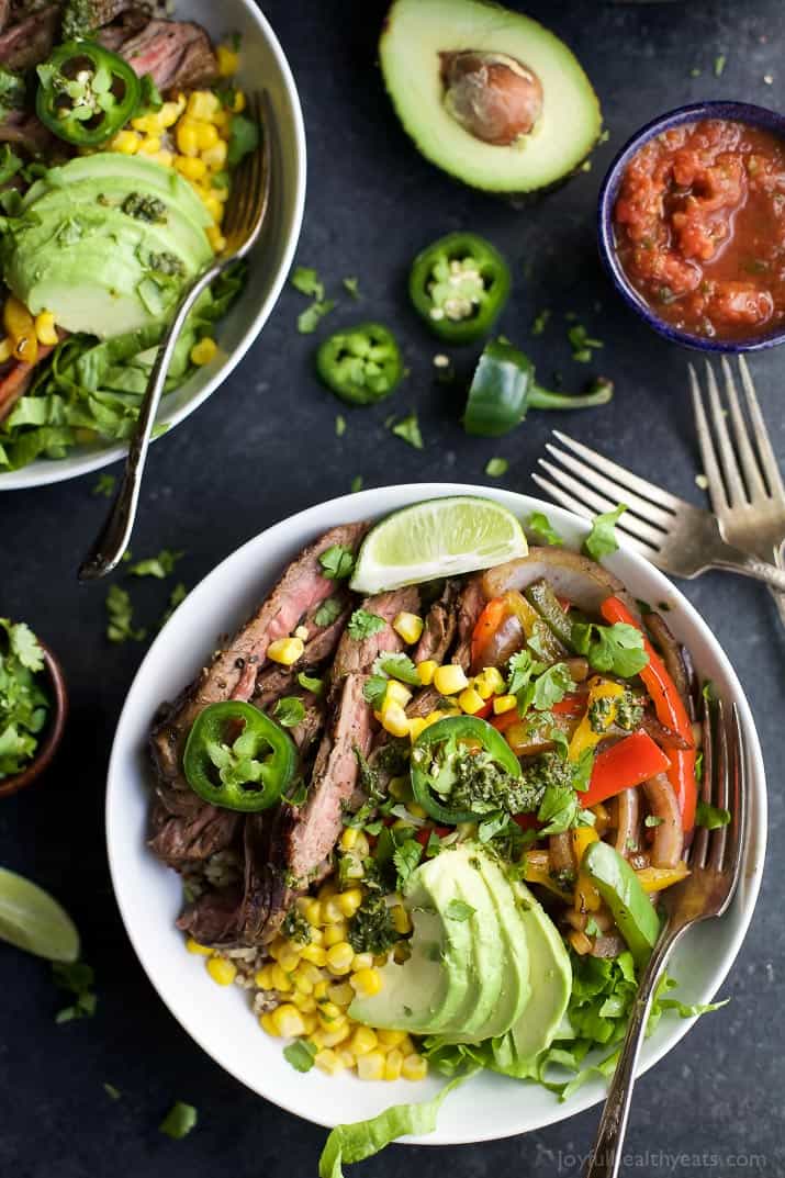 steak burrito bowls filled with quinoa, fajita steak, avocado and a cilantro lime chimichurri sauce 