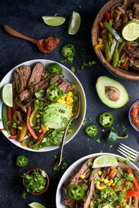 a display of burrito bowls made with vegetables and sliced steak