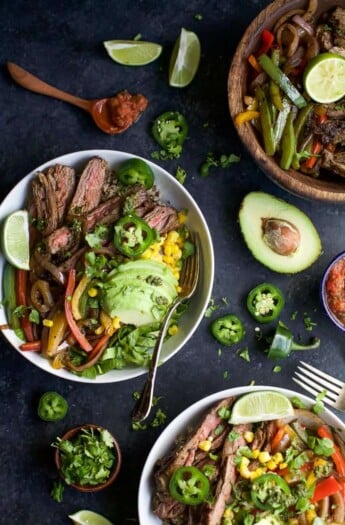 a display of burrito bowls made with vegetables and sliced steak