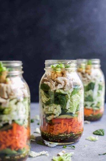 Mason Jar Salad recipes are a delicious, easy, and perfect lunch for the week! This ASIAN CHICKEN MASON JAR SALAD is loaded with veggies, napa cabbage, rotisserie chicken and topped with a Sesame Dressing - done in 30 minutes! | joyfulhealthyeats.com | gluten free recipes