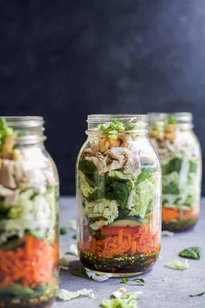Mason Jar Salad recipes are a delicious, easy, and perfect lunch for the week! This ASIAN CHICKEN MASON JAR SALAD is loaded with veggies, napa cabbage, rotisserie chicken and topped with a Sesame Dressing - done in 30 minutes! | joyfulhealthyeats.com | gluten free recipes