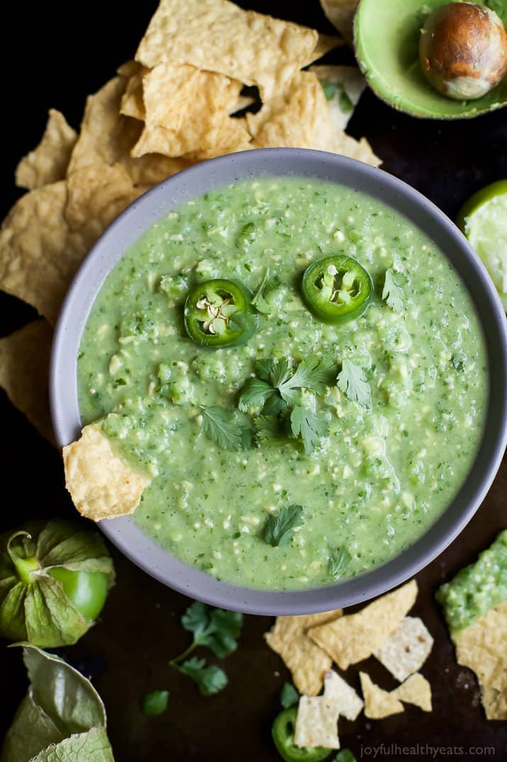 Bowl of Avocado Salsa Verde with jalapeno slices and fresh cilantro