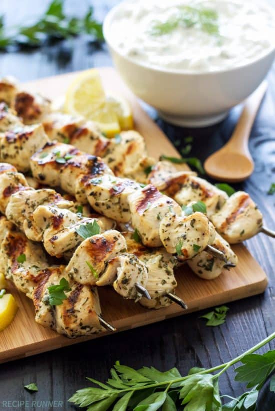 Lemon, garlic, oregano, and parsley add amazing flavor to these chicken skewers! Serve them with healthy homemade tzatziki sauce for a delicious and easy to make meal!