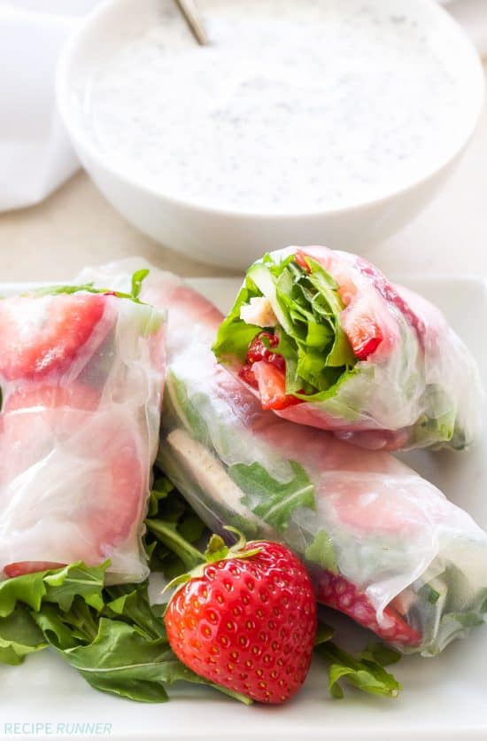 These fresh and crunchy Grilled Chicken and Strawberry Spring Rolls are full of summer flavor! Dip them in a healthy poppy seed dressing for a fun and easy appetizer or light dinner!