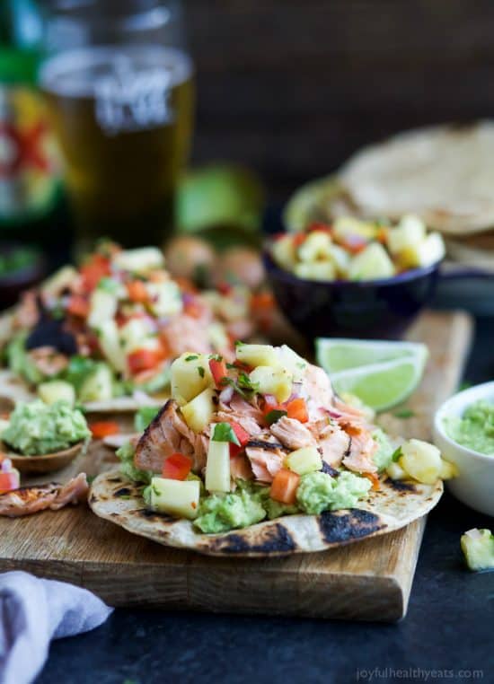 Pineapple Chipotle Salmon Tostadas - slightly charred smoky Salmon combined with Spicy Pineapple Salsa and creamy Avocados. These Tostadas take 30 minutes to make and are only 283 calories, a must make for a busy weeknight!