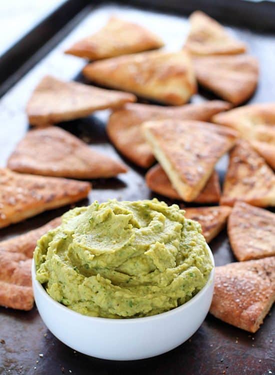 Avocado Hummus with Homemade Pita Chips – you will go crazy for the combo of avocado, garbanzo beans and spices! Dip in some easy homemade pita chips, and you have yourself a healthy, flavorful snack!
