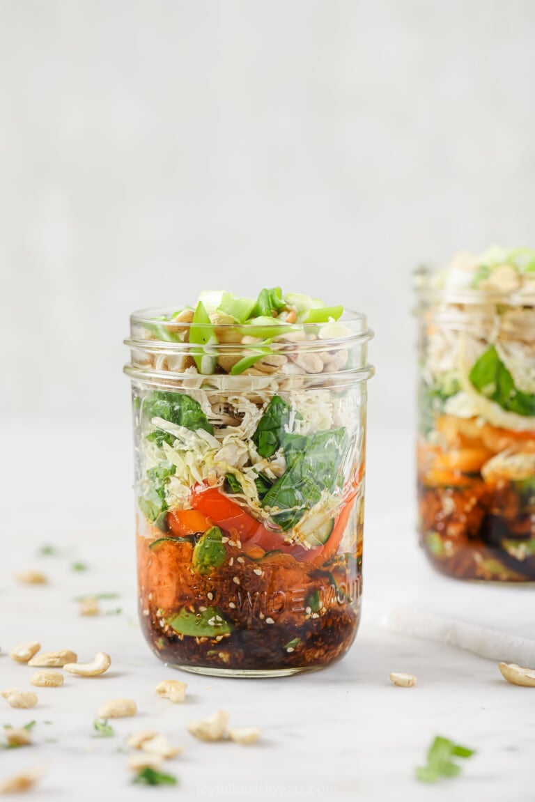 Mason jar salads with chicken and homemade dressing.