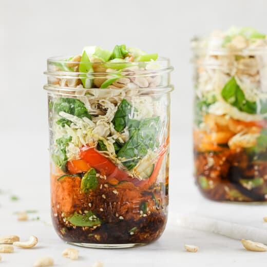 Landscape photo of mason jar salads.