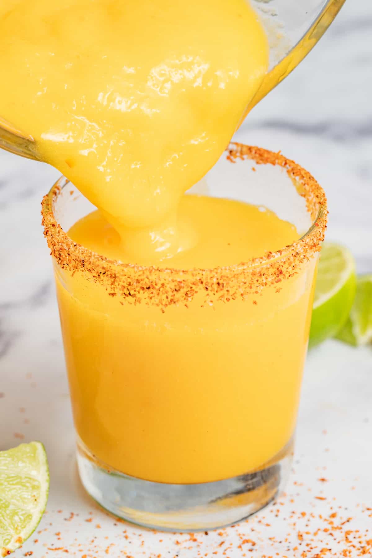 Pouring the mixture into a serving glass.