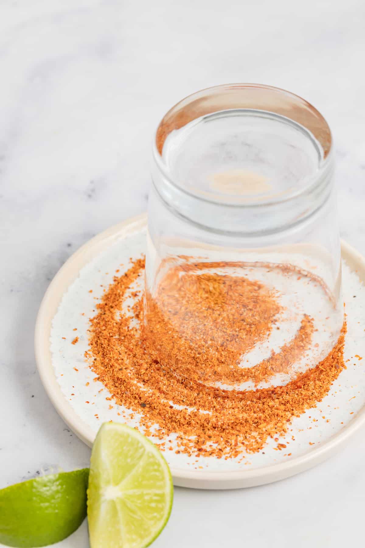 Adding the chili to the rim of the glass. 