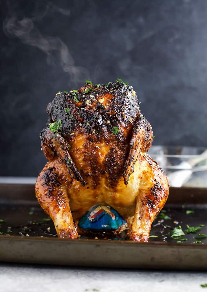 Glazed Honey Garlic Beer Can Chicken standing upright on a pan