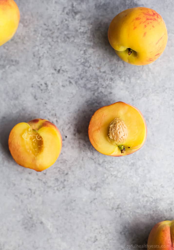 Top view of halved fresh peaches