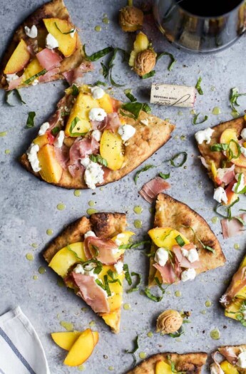 Grilled Flatbread Pizza topped with Peaches, Prosciutto, Goat Cheese, and fresh Basil! The ultimate summer grilling recipe done in just 30 minutes!