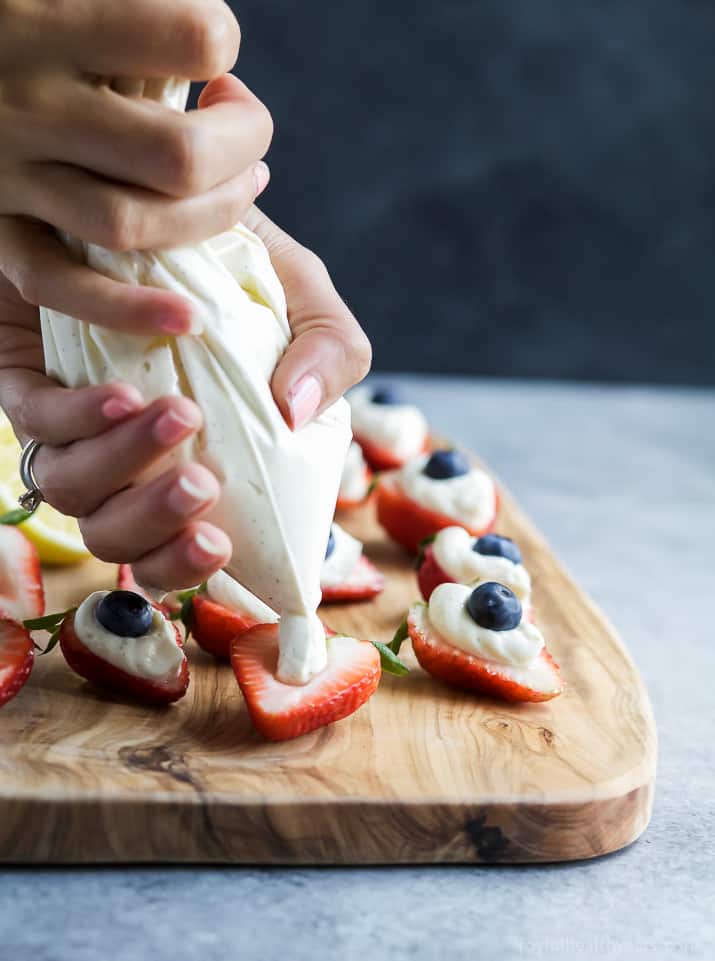 Patriotic Cheesecake Stuffed Strawberries - an easy healthy recipe that tastes like strawberry cheesecake but without all the calories!