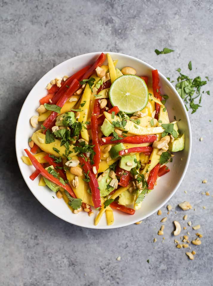 THAI MANGO AVOCADO SALAD - an easy, light, gluten free salad perfect for the summer! Filled with fresh mango, red pepper, avocado, and a light sesame vinaigrette to bring everything together!