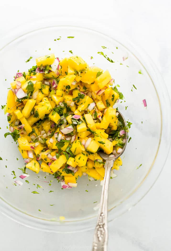 Overhead view of a bowl of mango salsa