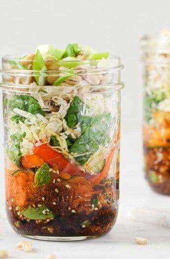 Landscape photo of mason jar salads.