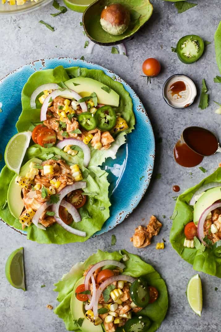 chicken tacos made with lettuce wraps on a blue plate