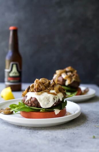 Caramelized Onion & Mushroom Burgers served "bunless" and topped with a creamy Horseradish Aioli. A gluten free burger recipe you'll want all summer long! | grilling recipe