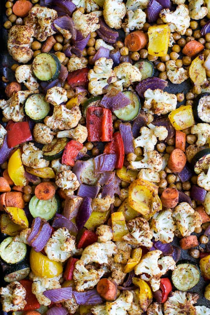 Roasted Vegetable Grain Bowls – a gluten free grain bowl filled with spiced roasted vegetables then covered in a creamy Tzatziki Sauce. A meal your family will love and perfect for meatless Monday!