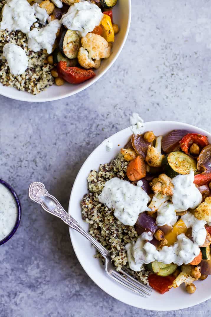 Roasted Vegetable Grain Bowls – a gluten free grain bowl filled with spiced roasted vegetables then covered in a creamy Tzatziki Sauce. A meal your family will love and perfect for meatless Monday!