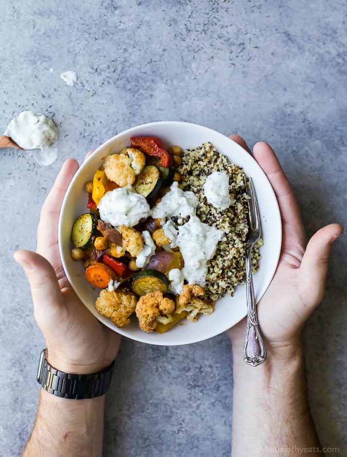 Roasted Vegetable Grain Bowls – a gluten free grain bowl filled with spiced roasted vegetables then covered in a creamy Tzatziki Sauce. A meal your family will love and perfect for meatless Monday!