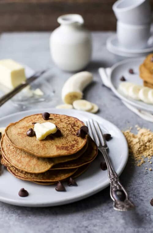 Flourless Peanut Chocolate Chip Pancakes made in the blender and only 290 calories. The perfect breakfast for Saturday mornings! Plus who can resist chocolate and peanut butter! | #ad | gluten free recipes