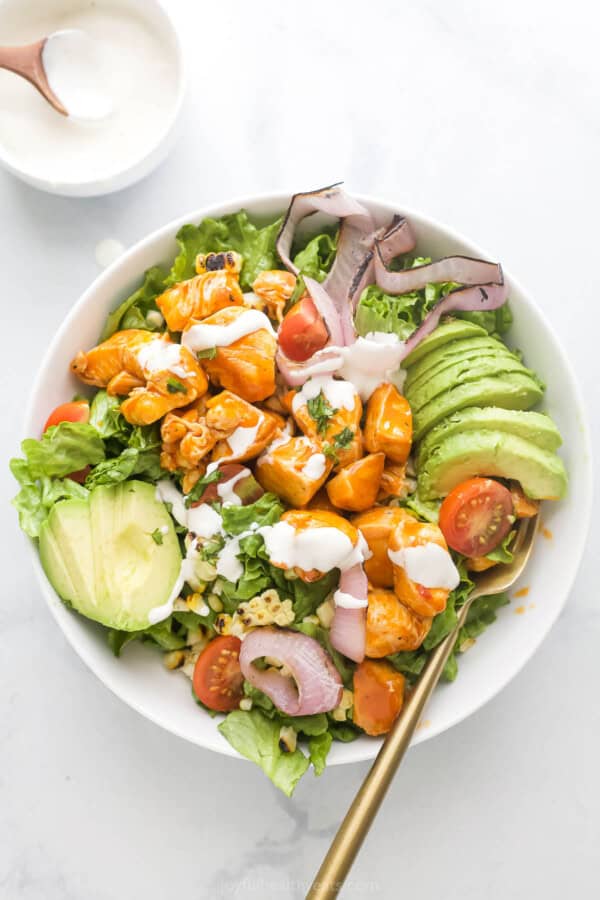 Buffalo chicken salad with grilled veggies and ranch dressing on the side.
